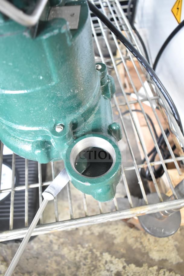 BRAND NEW SCRATCH AND DENT Zoeller 63-0001 Premium Series M63 sump pump, 115V, 1 phase, visible green housing on metal rack.
