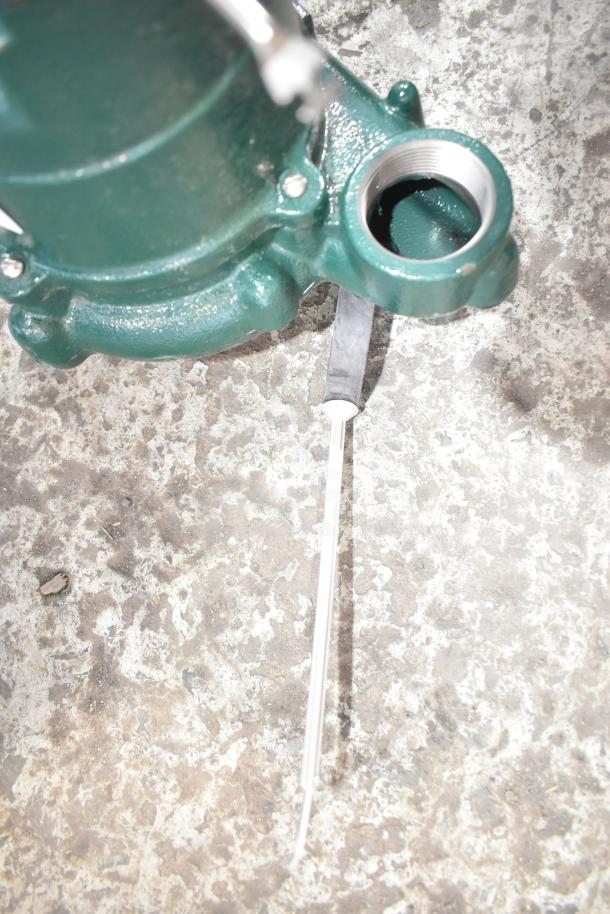 BRAND NEW Zoeller 63-0001 M63 Sump Pump, 115 Volts, 1 Phase, visible scratch, green housing, metal construction.