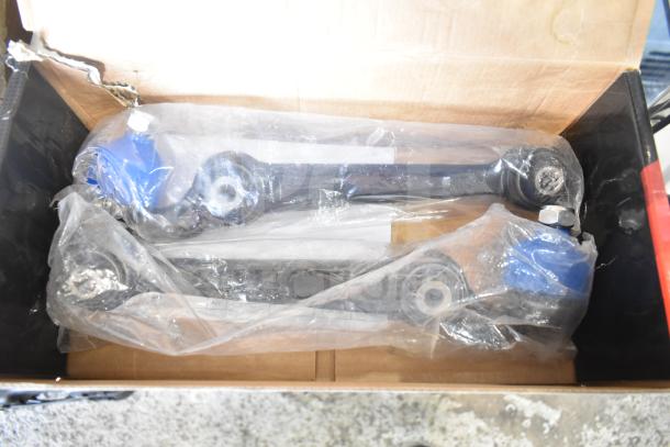 Brand new chassis parts control arm kits, H102527064 CAK30176-C, in original packaging with minor scratches.