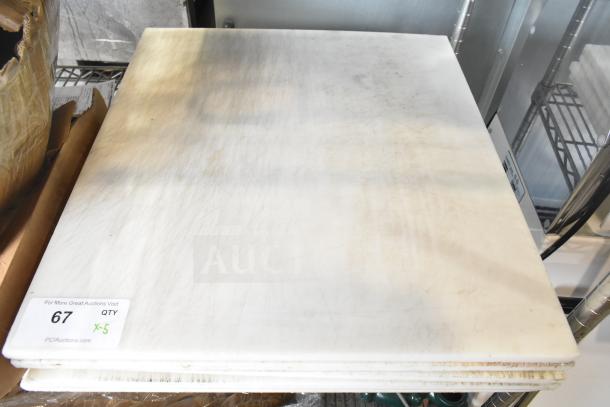5 brand new white cutting boards, slightly scratched. Auction tag indicates quantity of 5.