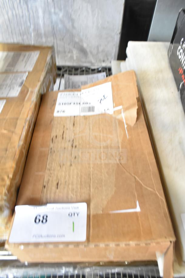 Cardboard box for BRAND NEW T&S 5105F1SLX03 deck-mounted faucet. Visible shipping labels and auction tag, slightly dented condition.