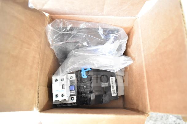 Box with brand new CHNT CJX2-18 contactor, GB/T 14048.5 standard. Scratch and dent condition, labeled parts visible.