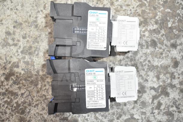 Two brand new CHNT CJX2-18 contactors with CHNT GB/T 14048.5 labeling, never used, minor cosmetic dents.