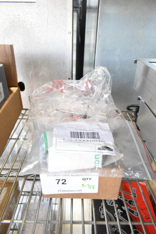 Three new scratch and dent items: Vollrath Emergency Stop Switch, True Refrigeration Start Component Kit, Carnival King Popcorn Kettle, in original packaging.