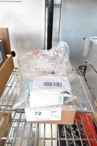 Three new scratch and dent items: Vollrath Emergency Stop Switch, True Refrigeration Start Component Kit, Carnival King Popcorn Kettle, in original packaging.