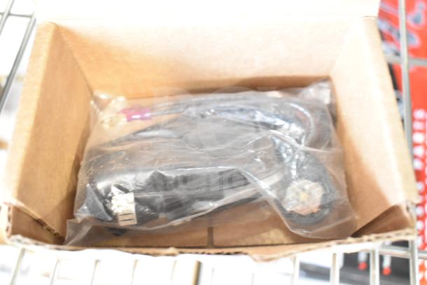 3 new scratch and dent items in box, including Vollrath XMIX8202 switch, True Refrigeration start kit, Carnival King kettle.