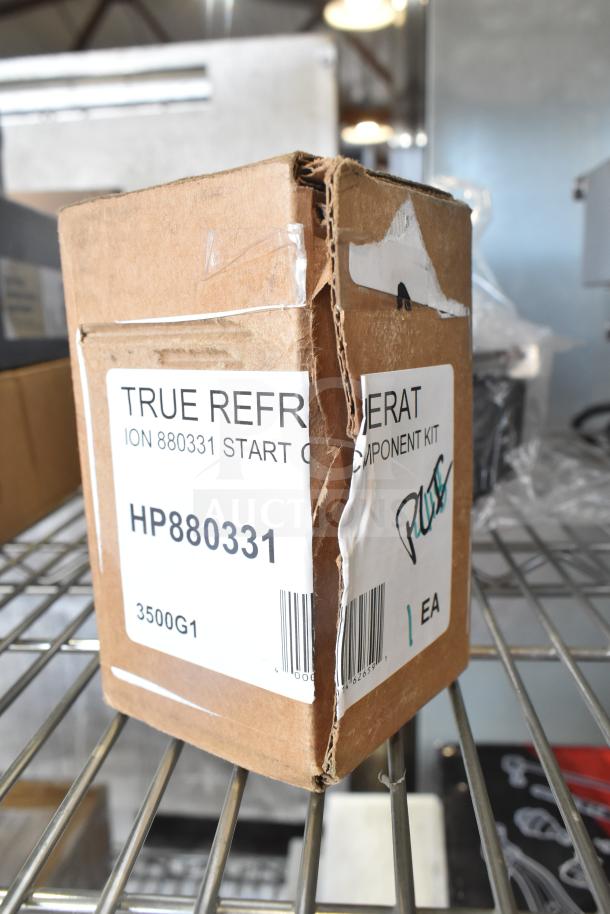 Three new scratch and dent items: Vollrath XMIX8202 Emergency Stop Switch, True Refrigeration 880331 Start Component Kit, Carnival King 382PM4KETTLE Replacement Kettle.