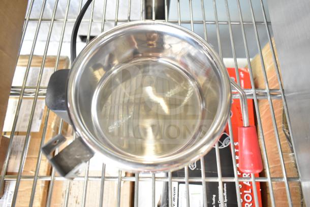 Stainless steel Carnival King 382PM4KETTLE replacement kettle on metal rack, brand new condition.
