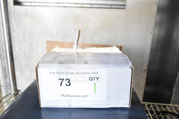 Brand new BOP20 charger in box, marked "scratch and dent". Box labeled with auction number 73, quantity 1.