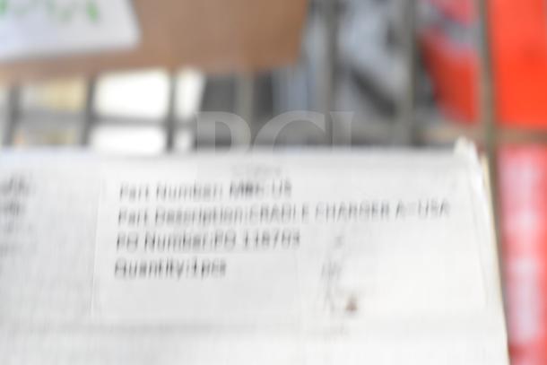 Brand new, slightly damaged BOP20 Charger in original packaging. Box label shows part number MRC-US.