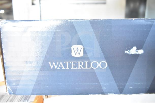 BRAND NEW SCRATCH AND DENT! Waterloo 33.8 fl. oz. automatic deck-mounted chrome soap dispenser box with visible logo.