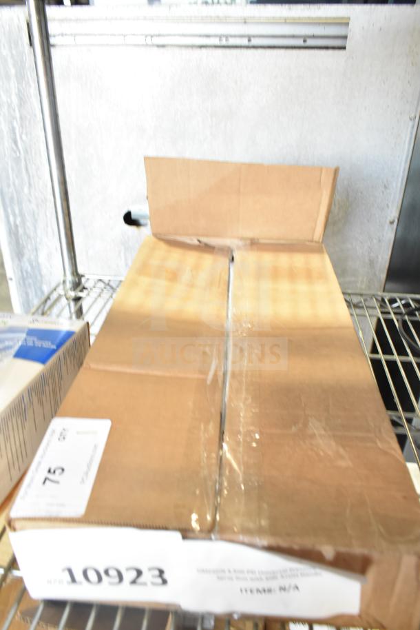 Cardboard box labeled "10923" containing a Simpson 4,500 PSI Universal Pressure Washer Spray Gun, brand new with scratches and dents.