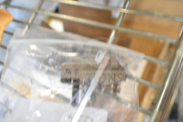 Three brand new scratch and dent items include HP93021 Southbend Hi Limit Thermostat, Heatcraft DTAV40 Electric Timer, Lancaster Table & Seating Chair Cushion.