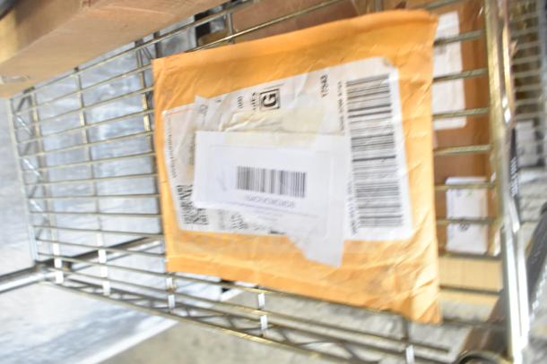 Packaging on a shelf. Contents include HP93021 Southbend thermostat, Heatcraft DTAV40 timer, Lancaster brown vinyl chair cushion. Brand new.