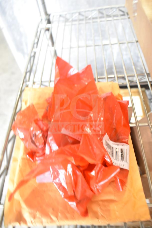 Three packaged items on a shelf wrapped in red plastic. Includes Southbend thermostat, Heatcraft timer, and chair cushion. New condition.