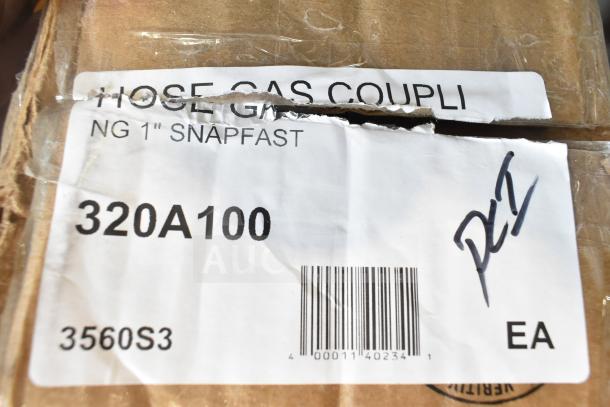 Cardboard box with partial label for NG 1" Snapfast hose gas coupling, marked "320A100" and "3560S3," slightly torn.