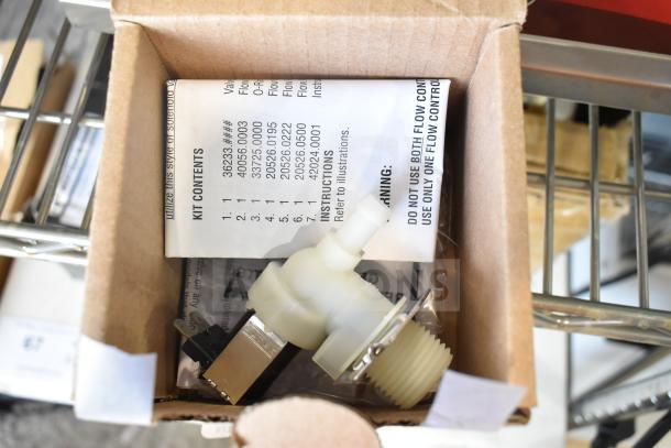 Cardboard box with a new thermocouple, control board, and pilot assembly. Includes kit contents and instructions, labeled "DO NOT USE BOTH FLOW CONTROLS."