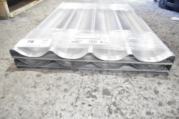 New 176BAGPAN4AS glazed aluminum baguette pan, 4 loaf capacity, 26" x 3 7/8" x 1" per compartment, scratch and dent condition.