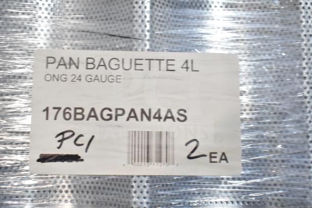 Brand new 176BAGPAN4AS glazed aluminum baguette pan, 4-loaf capacity, 26" x 3 7/8" x 1" compartments. Packaging label included.