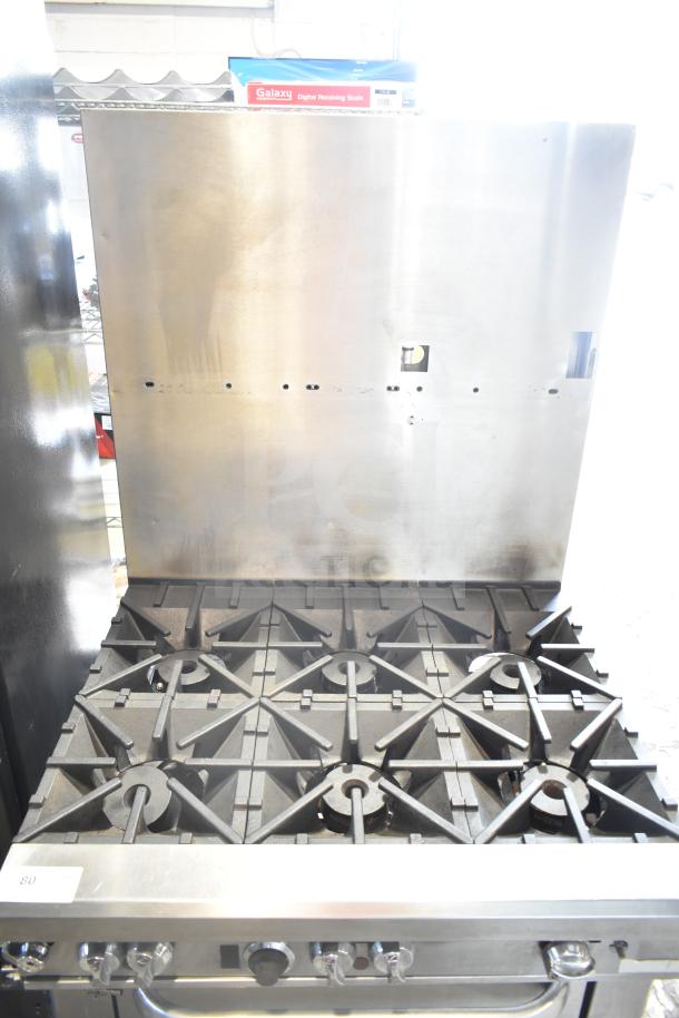 Southbend commercial gas 6 burner range with oven and backsplash. Features durable construction, in good condition.