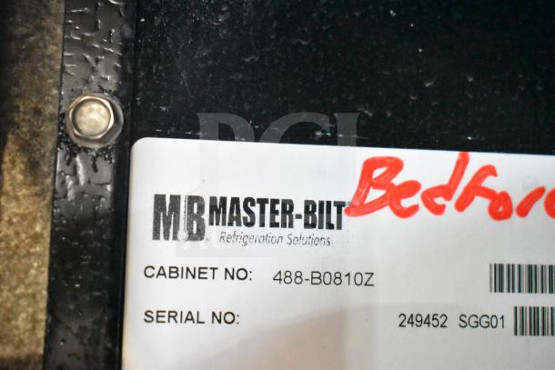 Label on a Master-Bilt BLG-48-HGP freezer showing cabinet number 488-B0810Z and serial number 249452, partially obscured text.