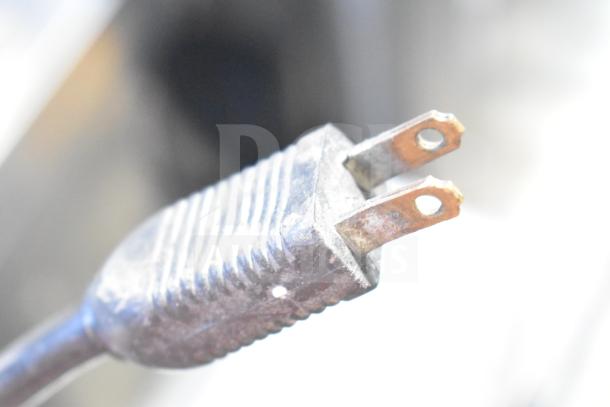 Electrical plug for Hobart A200 20 Quart Planetary Mixer, showing wear, designed for 115 volts, 1 phase use.