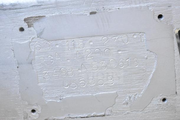 Engraved metal plate for Hobart A200 mixer, showing model number and specifications for voltage and phase.