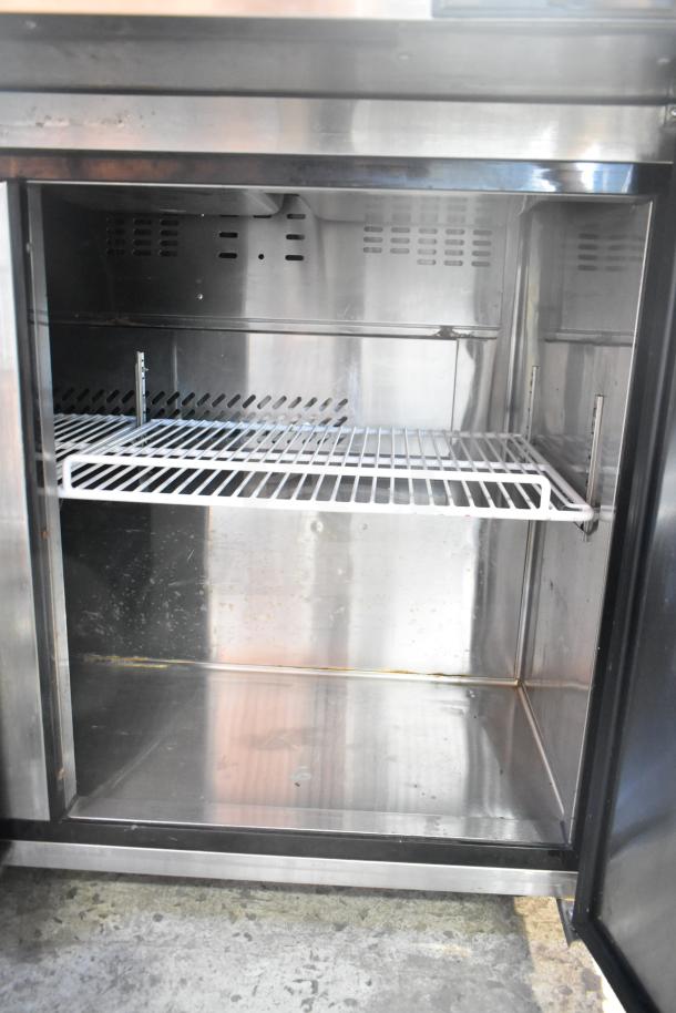 Atosa Commercial Prep Table, stainless steel, single-phase, 115 volts, open panel view showing shelving. Used condition.