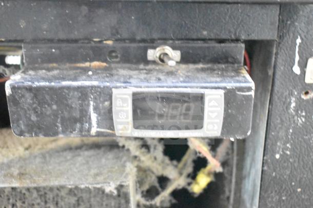 Master-Bilt IM-23GB freezer control panel displaying temperature; shows wear and dust.