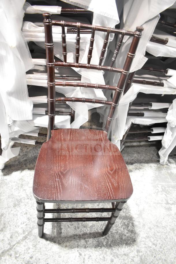 Brand new Flash Furniture XS-WALNUT-GG Hercules stacking Chiavari chair in walnut finish, scratch and dent condition.