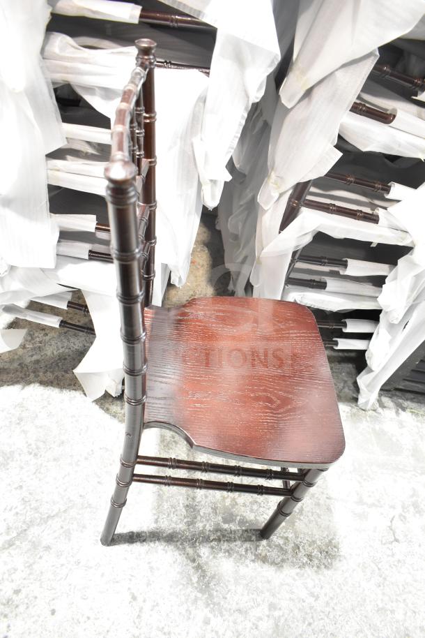 Brand new Flash Furniture XS-WALNUT-GG Hercules Walnut Chiavari Chair. Scratch and dent condition. Stacked, hardwood frame.