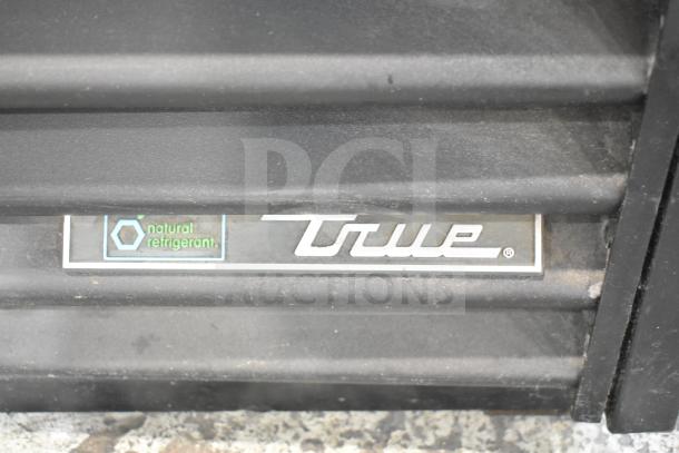 True GDM-41SL-48-HC-LD logo on commercial cooler featuring natural refrigerant label.