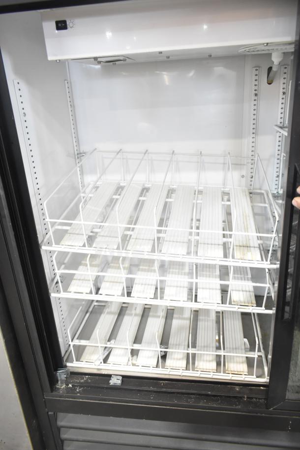 True GDM-41SL-48-HC-LD commercial cooler, 2 doors, white interior shelves, excellent condition, 115V, 1 phase.