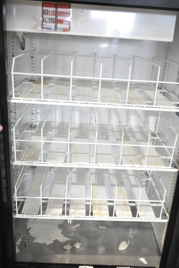 True GDM-41SL-48-HC-LD commercial cooler, 2 door, white racks, visible interior wear, model label on unit. 115V, 1 phase.