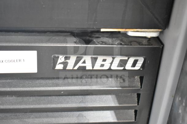 Habco ESM12 commercial cooler merchandiser, black exterior, single door, 115 volts, 1 phase, branded logo visible.