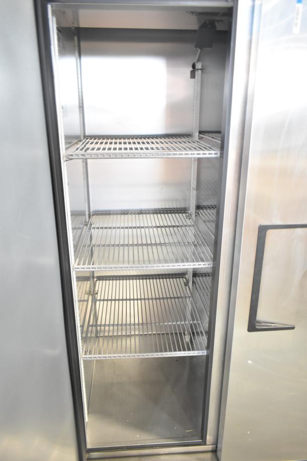 2022 True T-35-HC 2 Door Reach-In Cooler, commercial casters, shelves, 115V, 1 phase, excellent condition.