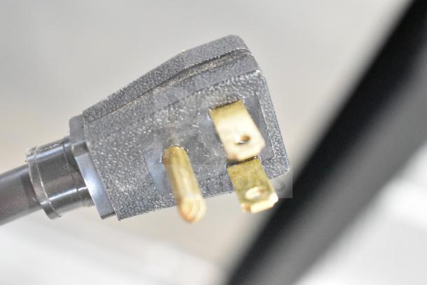 Close-up of a plug for the 2022 True T-35-HC Commercial 2 Door Reach In Cooler. 115 Volts, 1 Phase.