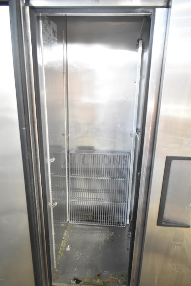 2017 True T-35 commercial 2 door reach-in cooler, on casters, 115 volts, 1 phase, visible shelving, signs of wear.