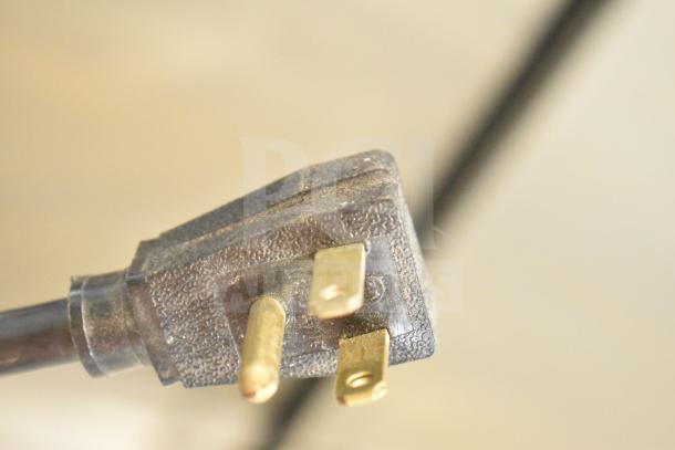 Close-up view of a power plug for a 2017 True T-35 cooler, indicating 115V, 1 phase requirement.