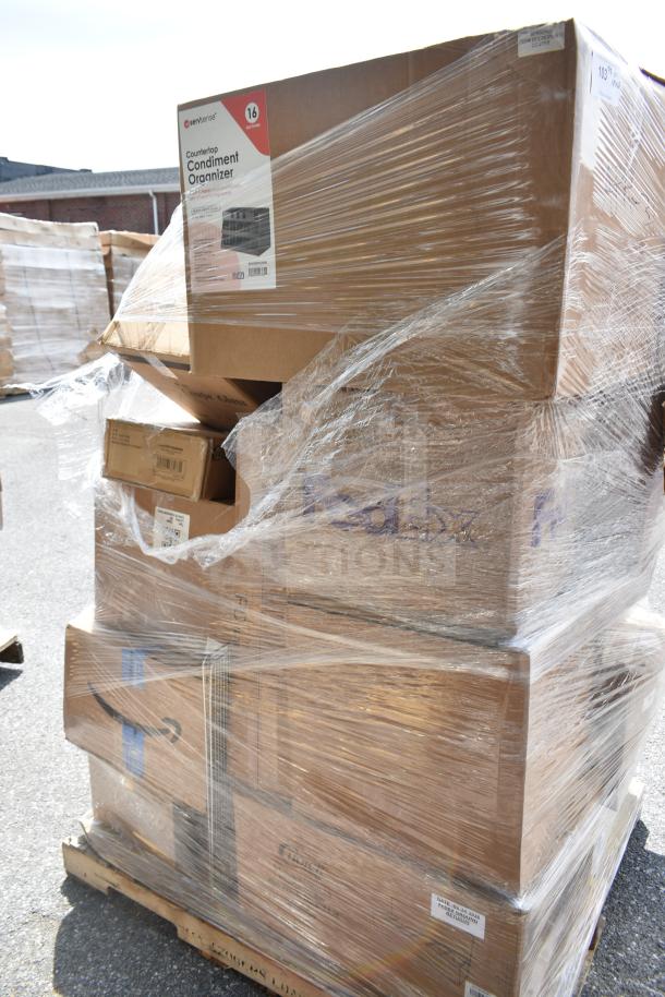 Pallet with 26 brand new scratch and dent items wrapped in plastic, including wine glasses and fryer tray. Boxes labeled for shipping.