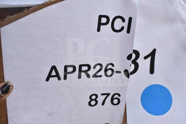 Labels on a cardboard box marked "PCI APR26-31 876" visible, indicating auction details.