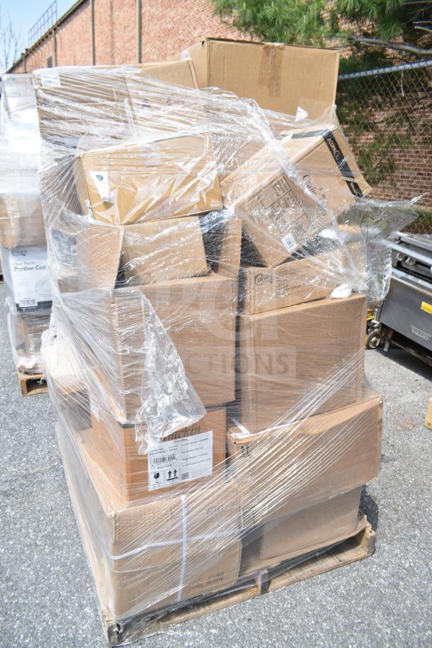 Pallet of 26 brand new scratch and dent items, including wine glasses, cake molds, and fryer tray, wrapped in plastic.