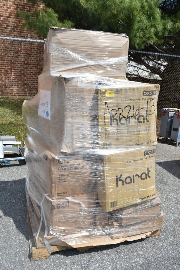Pallet of 28 new scratch and dent items, including flat lids, cups, containers. Marked "APR26-13" and "Karat." Wrapped in plastic.
