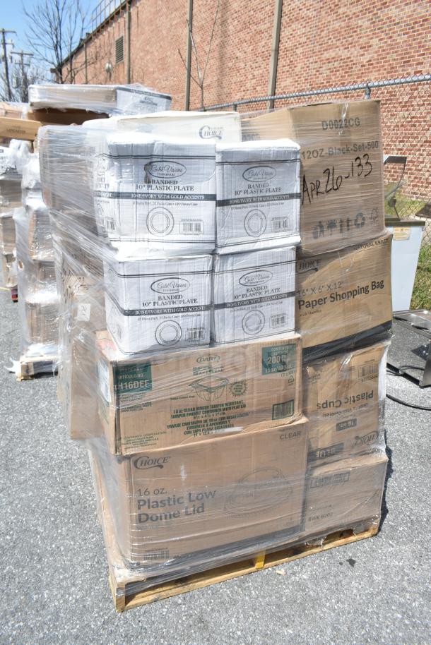 Stack of brand new items on a pallet, including Gold Visions plates and Choice shopping bags, 26 pieces, marked as scratch and dent.