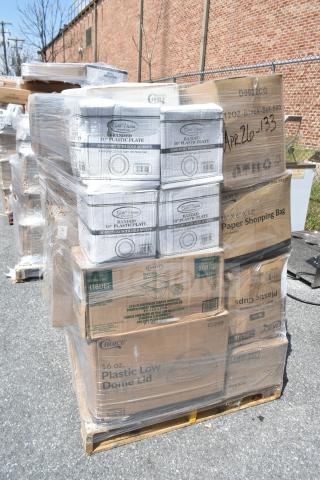 Stack of brand new items on a pallet, including Gold Visions plates and Choice shopping bags, 26 pieces, marked as scratch and dent.