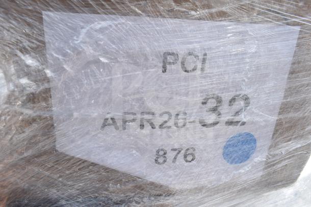 Plastic-wrapped pallet with label "APR26-32," containing 34 scratch and dent items: condiment jars, food trays, containers.