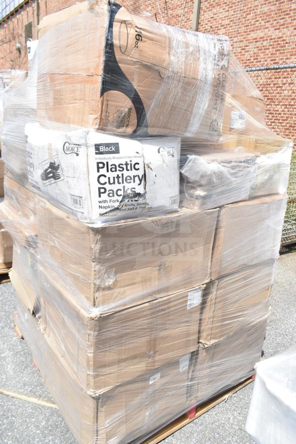 Stacked pallets with wrapped boxes labeled "Plastic Cutlery Packs" and "16 oz.", indicating scratch and dent items.