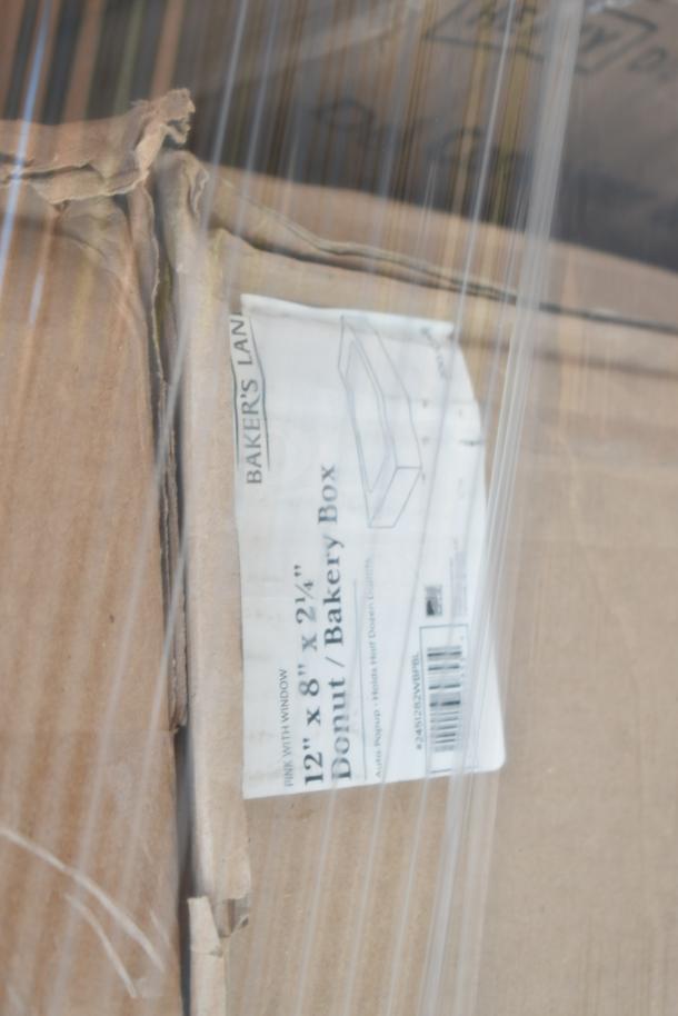 Cardboard box labeled "Baker's Lan Donut/Bakery Box, 12x8x2.25 in, Pink with Window" in new, scratch and dent condition.