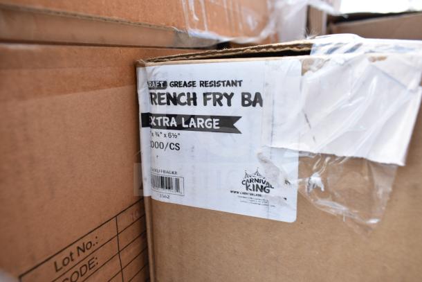 Cardboard box with labels reading "Kraft Grease Resistant French Fry Bags, Extra Large, 1000/CS, Carnival King." Sealed with clear tape.