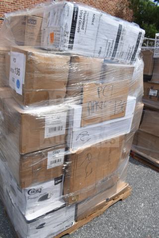 Pallet of boxed scratch and dent food service items, including plates and cups. Boxes labeled Tork, Noble, and Choice.